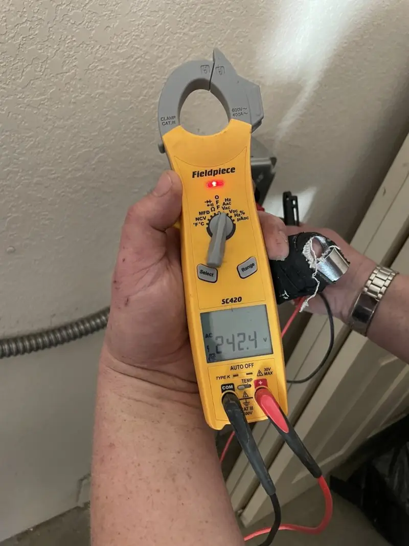 Voltage testing with clamp meter during Electrical Installation Services in Hearne